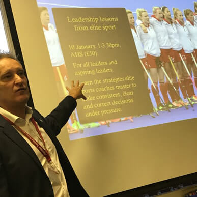 Matt Messias standing in front of a presentation screen